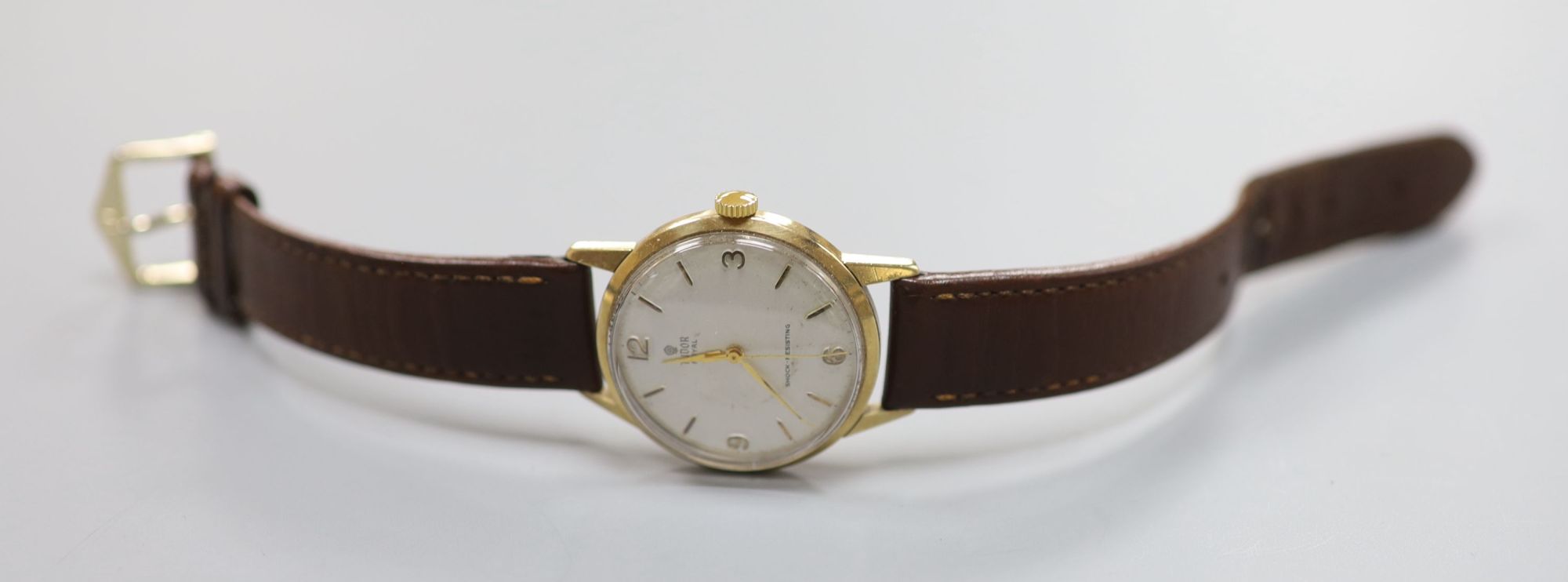 A gentlemans early 1960s 9ct gold Tudor Royal manual wind wrist watch, on associated leather strap,